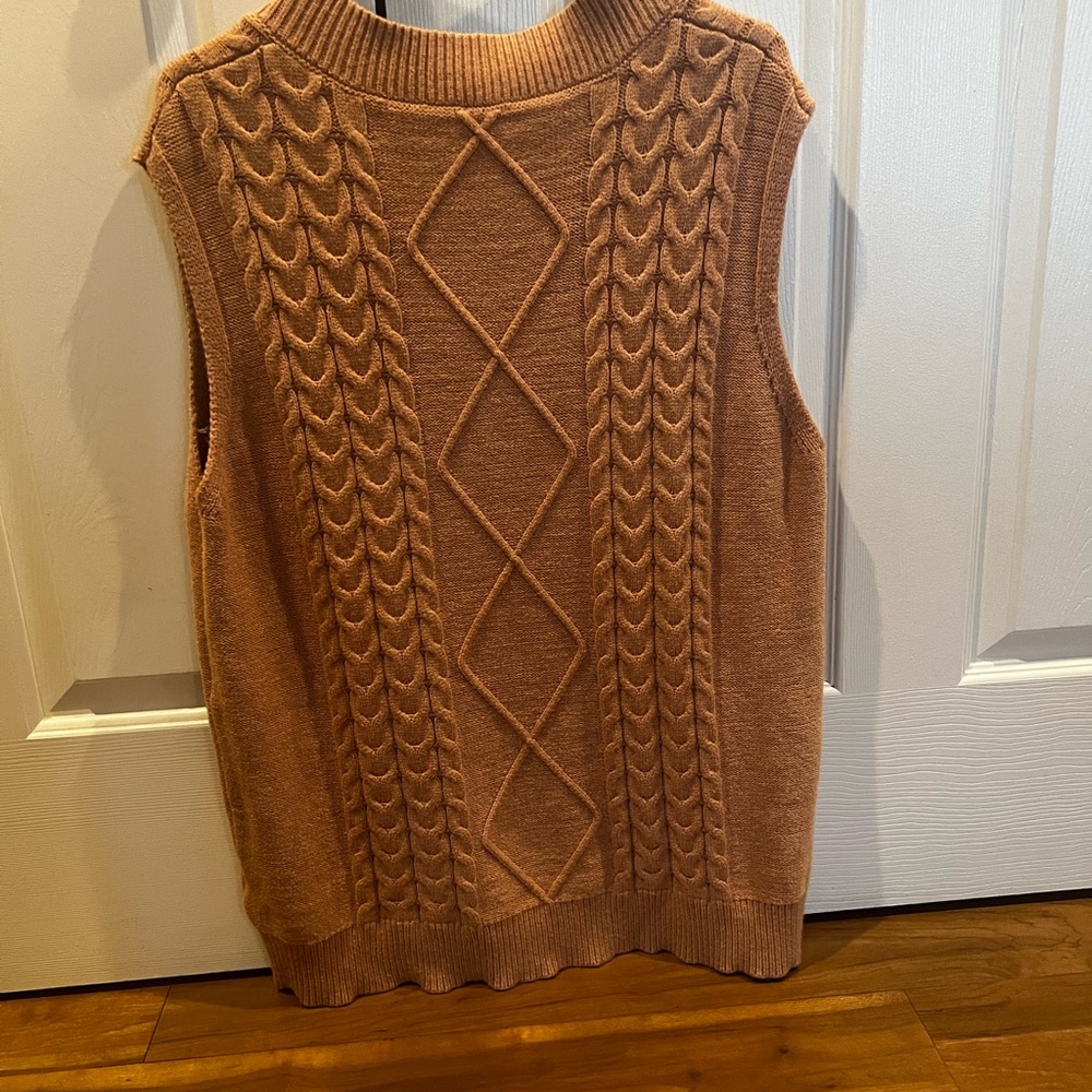 Women’s cable knit vest.